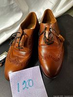 Top view of both shoes showing wingtip design and laces