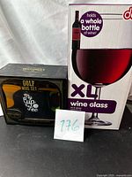 Front view of both boxed items showing product names and packaging