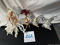 Group of four figurines with lot number visible