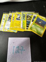 Fan of Pokémon cards showing titles and artwork
