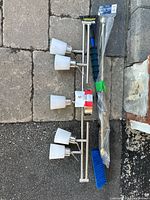 Both brushed nickel bar fixtures with six frosted shades visible