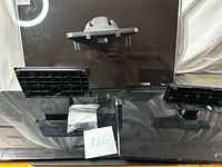 Front view of two glass-base stands and separate bracket