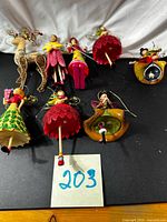 Group shot showing all eight ornaments on black background