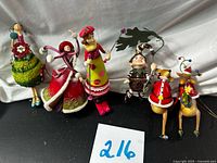 All six whimsical ornaments lined up