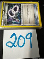 Top of stack showing Trainer Item Latios Spirit Link card in sleeve