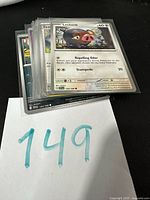 Stack of sleeved Pokémon cards, Lechonk on top