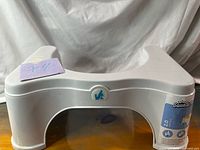 Front view of Squatty Potty 2.0 showing logo and arch clearance