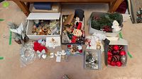 overview of all boxes showing ornaments, figurines, bows