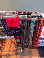 Rack showing multiple folded and draped scarves