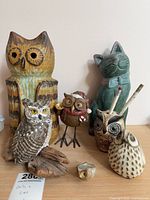 Group shot of all seven figurines on shelf