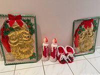 Entire lot showing 2 Santa plaques, 2 blow-mold candles, pair slippers