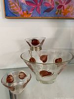 Full view of large bowl, dip bowl on bracket, extra bowl