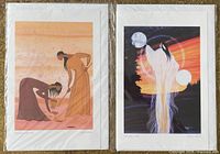 Overview of both signed prints side by side in sleeves