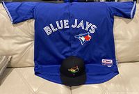 Full view of jersey laid flat with cap positioned at hem