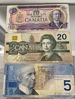 Fronts of $10, $20, and $5 Canadian bills stacked