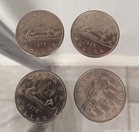 Top view of all four Voyageur dollar coins