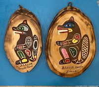 Both Indigenous beaver plaques side by side