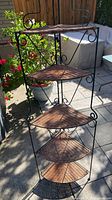 Full view of five-tier metal and wicker corner baker's rack