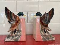 Both porcelain mallard duck bookends front view