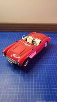 Top view of red 1957 Corvette die-cast convertible with beige interior