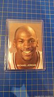 Front of Michael Jordan trading card in protective case