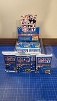 Display box and four sealed 1991 Pro Set Series 2 NFL card packs