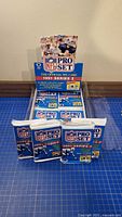Four sealed 1991 NFL Pro Set Series 2 packs shown in dispenser box