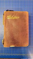 Front cover showing brown leather and gilt title
