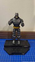 Front view of armored Batman on black base