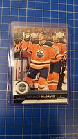 Front view of Connor McDavid Upper Deck card in sleeve