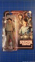 Front of sealed Stranger Things Chief Hopper action figure package