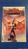 Front view of X Lives of Wolverine #2 variant cover comic in bag and board