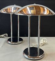 Both chrome mushroom table lamps angled view