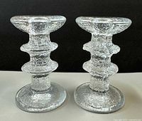 Front view of both textured glass candle holders