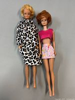 Two vintage Midge dolls front view showing outfits and overall condition