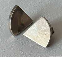 Front view showing geometric sterling silver earrings