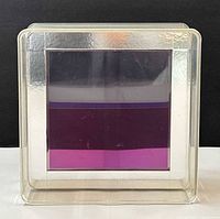 Front view of square lucite sculpture showing purple panel