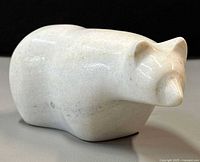 Front three-quarter view of stone polar bear sculpture