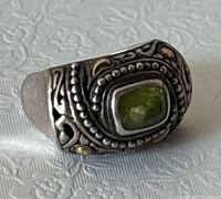 Front view showing green stone and gold/silver detailing