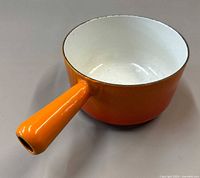 Top view showing white interior and orange enamel sides