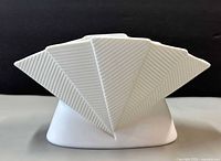 Front view showing folded fan design and ribbed texture