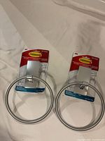 Two packaged 3M Command towel rings displayed side by side