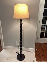 Lamp illuminated showing shade glow and full spindle column