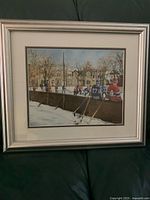 Front view of framed hockey print with mat and frame