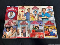Front view of eight Home Improvement season DVD cases arranged in two rows