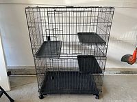 Cat crate assembled showing three shelves, bottom tray and wheels