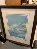 Front view of framed lithograph showing artwork, matting and frame
