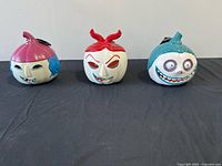 Front view of all three character pumpkins