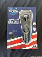 Front of sealed Barbasol rechargeable rotary shaver box