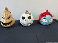 All three Nightmare Before Christmas character pumpkins on table